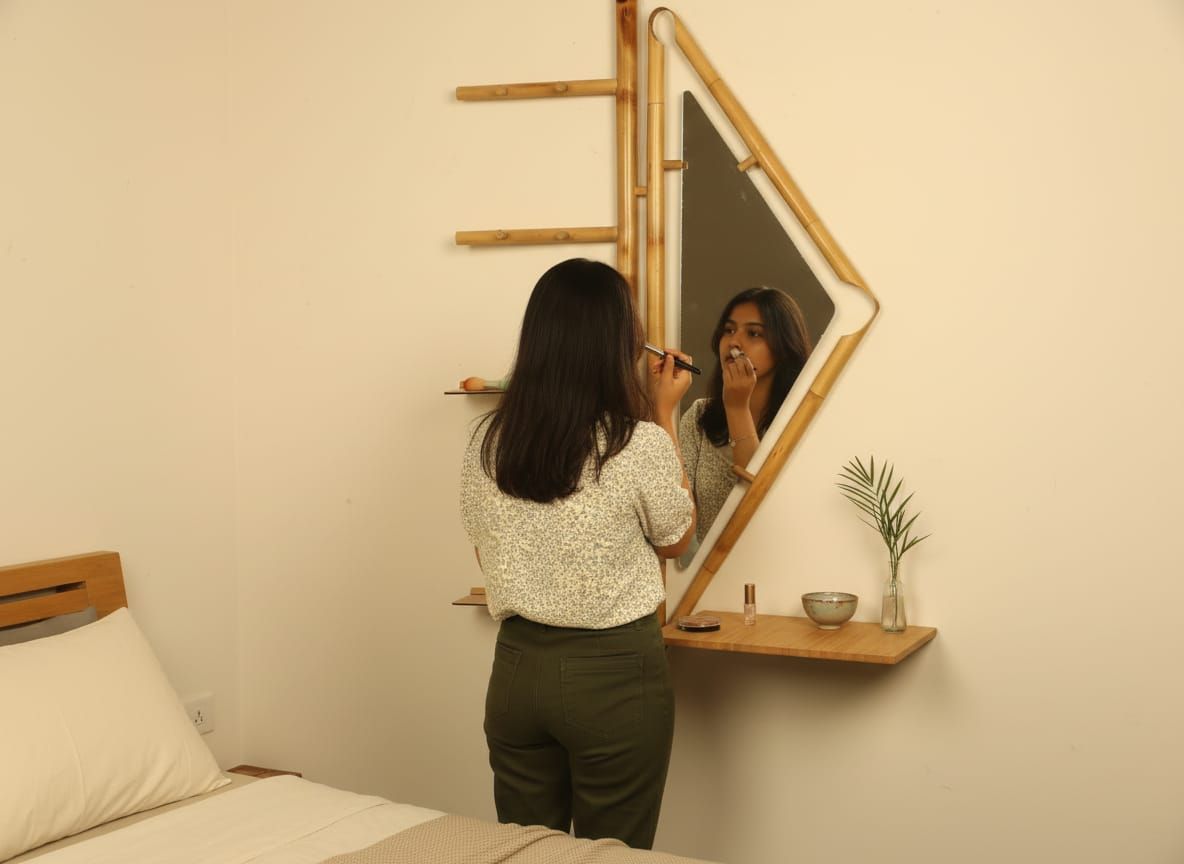 Person using Darpana in compact bedroom setting